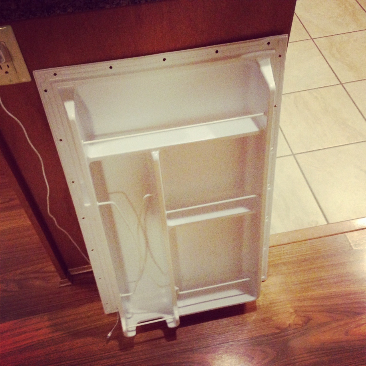 The Mini-Fridge Shelves From The Door After Removal