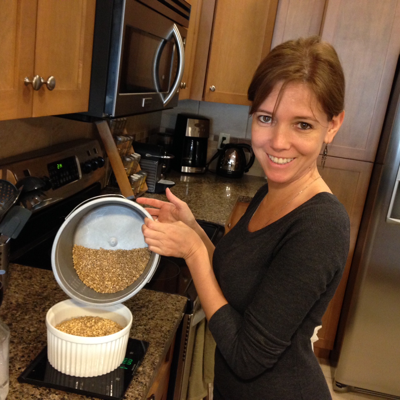 Luciana, helping measure grains